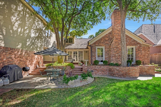 2606 S Lipscomb St, Amarillo, TX 79109 - back of property with a patio area and a lawn