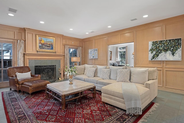 2606 S Lipscomb St, Amarillo, TX 79109 - living area featuring a decorative wall, a tiled fireplace, and recessed lighting