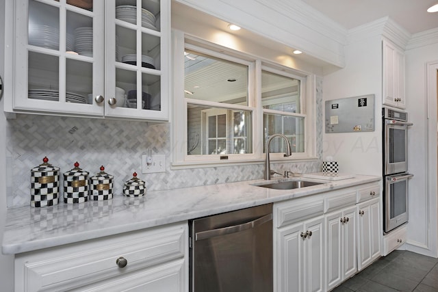 2606 S Lipscomb St, Amarillo, TX 79109 - kitchen featuring light stone countertops, sink, white cabinets, and appliances with stainless steel finishes
