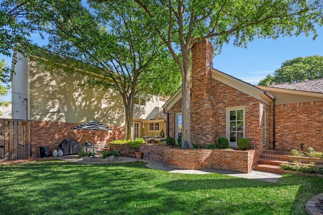 2606 S Lipscomb St, Amarillo, TX 79109 - view of property exterior featuring a lawn and a patio area