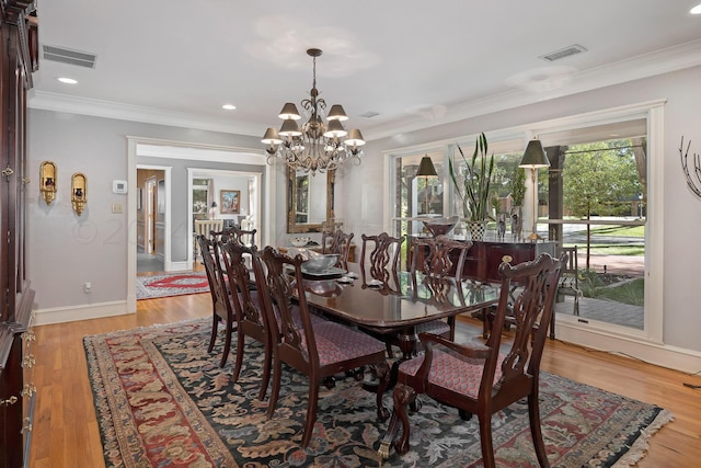 2606 S Lipscomb St, Amarillo, TX 79109 - dining room with a chandelier, ornamental molding, light wood-style floors, and baseboards