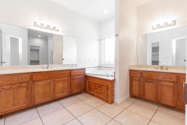 6203 Donda St, Amarillo, TX 79118 - bathroom featuring two vanities, tile patterned floors, and a bath