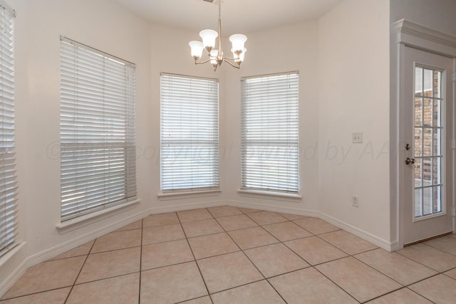 6203 Donda St, Amarillo, TX 79118 - unfurnished dining area with light tile patterned floors and a chandelier