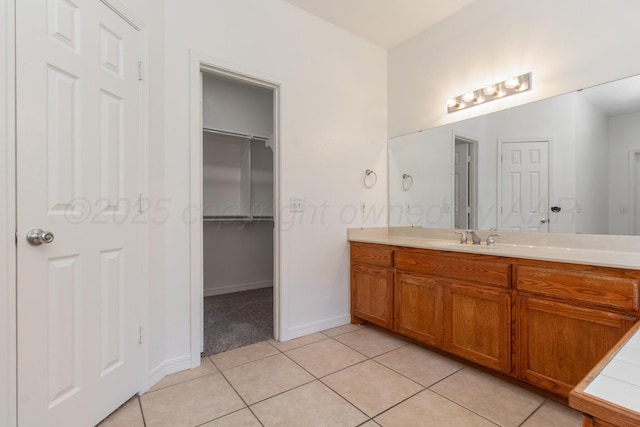 6203 Donda St, Amarillo, TX 79118 - bathroom with vanity, tile patterned flooring, and a spacious closet