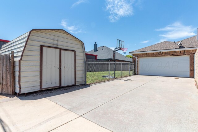 6203 Donda St, Amarillo, TX 79118 - garage with a storage shed