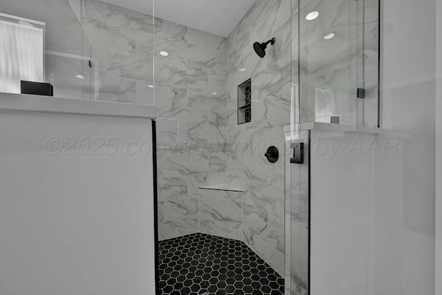 full bath featuring a marble finish shower