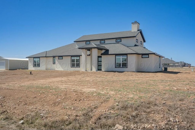 back of property featuring a chimney