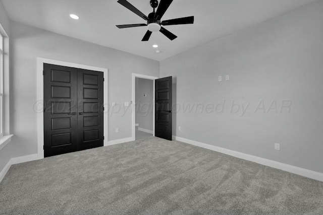 unfurnished bedroom featuring carpet floors, baseboards, and recessed lighting