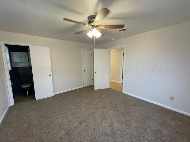 1805 N Jefferson St, Amarillo, TX 79107 - unfurnished bedroom featuring dark colored carpet and ceiling fan