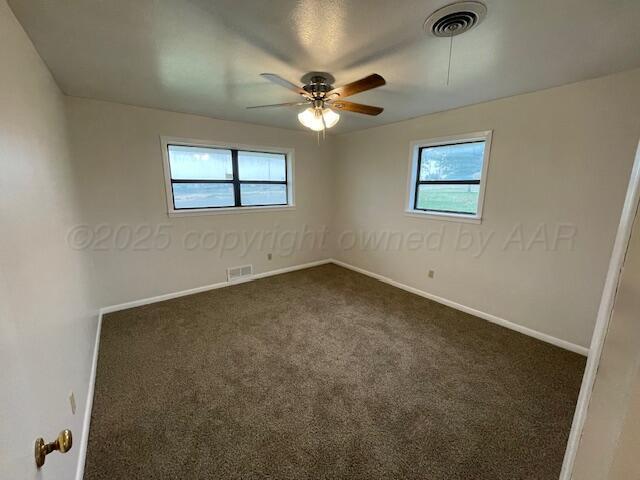 1805 N Jefferson St, Amarillo, TX 79107 - unfurnished room featuring ceiling fan and dark carpet