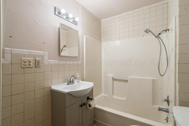 4002 S Tyler St, Amarillo, TX 79110 - full bathroom featuring tile walls, vanity, and shower / washtub combination