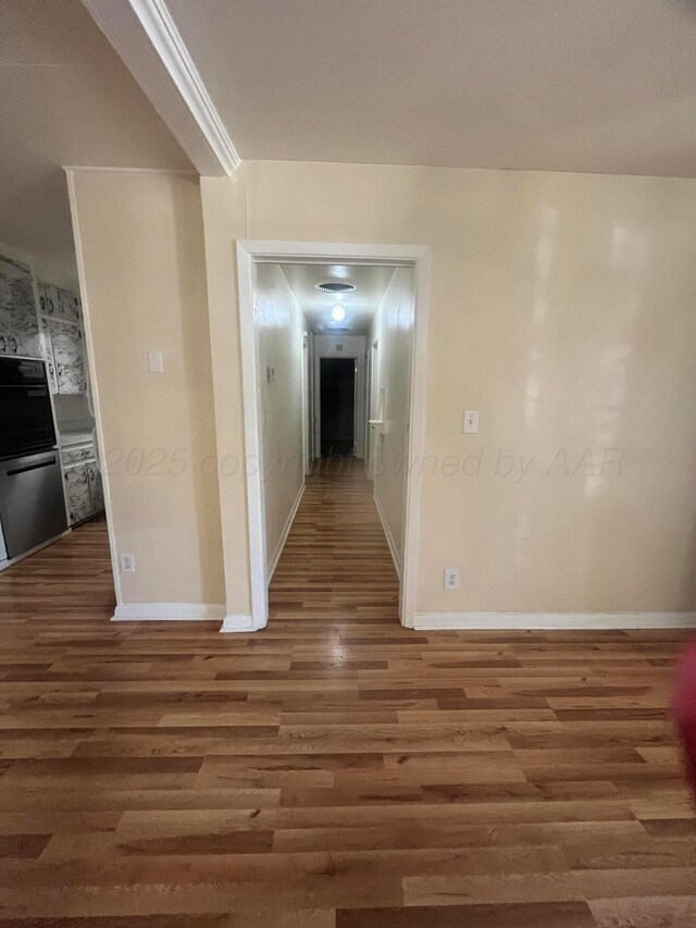 1565 Bell St, Amarillo, TX 79106 - hall with wood finished floors and baseboards