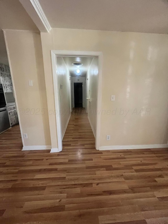 1565 Bell St, Amarillo, TX 79106 - corridor featuring wood finished floors and baseboards