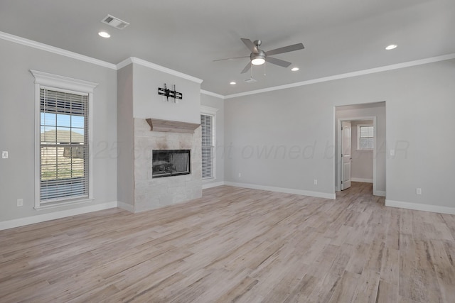 unfurnished living room featuring light wood finished floors, ornamental molding, ceiling fan, and visible vents
