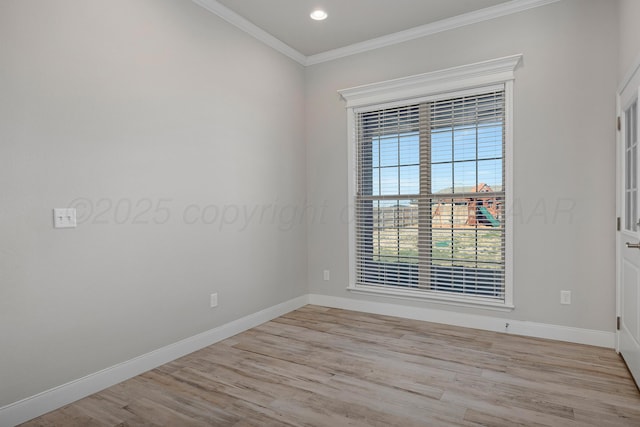 spare room featuring baseboards, crown molding, and light wood-style flooring