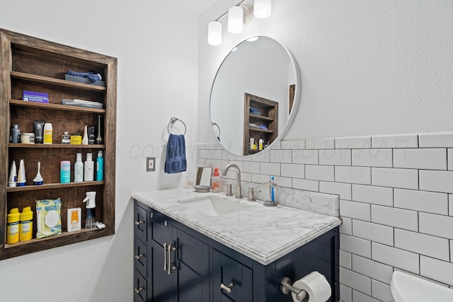 3313 Burrus Pl, Amarillo, TX 79121 - bathroom featuring vanity, tile walls, and a wainscoted wall