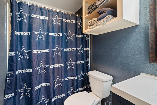 3313 Burrus Pl, Amarillo, TX 79121 - bathroom with vanity, a textured wall, and curtained shower