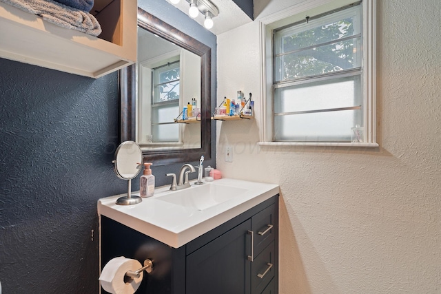 3313 Burrus Pl, Amarillo, TX 79121 - bathroom with a textured wall and vanity