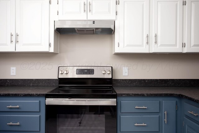 5214 George Ter, Amarillo, TX 79106 - kitchen with stainless steel electric range oven, blue cabinetry, under cabinet range hood, dark countertops, and white cabinets