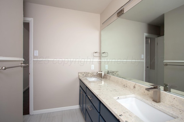 5214 George Ter, Amarillo, TX 79106 - bathroom featuring double vanity and marble look tiles