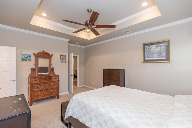 bedroom with a tray ceiling, light colored carpet, crown molding, baseboards, and a ceiling fan