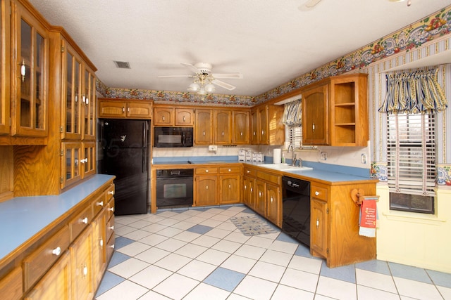 kitchen featuring visible vents, brown cabinets, black appliances, a ceiling fan, and light countertops