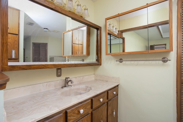 bathroom with vanity and visible vents