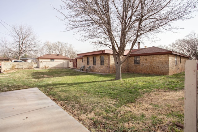 view of yard featuring a patio area and fence