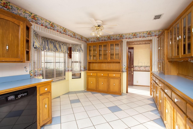 kitchen featuring glass insert cabinets, brown cabinets, dishwasher, and a ceiling fan