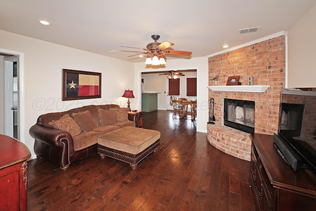 living room featuring a fireplace, hardwood / wood-style flooring, a ceiling fan, and recessed lighting