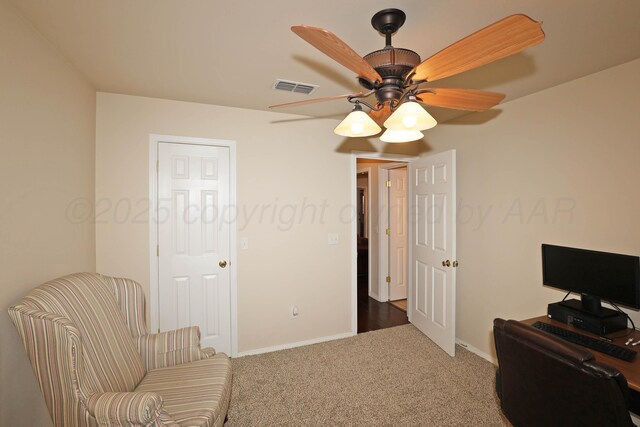 office space featuring carpet flooring, ceiling fan, and baseboards