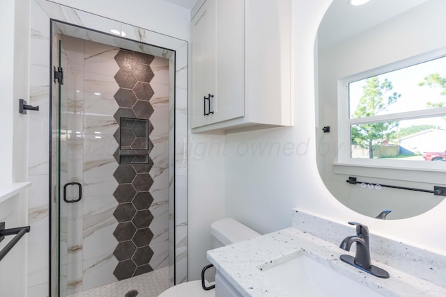 3807 Hancock St, Amarillo, TX 79109 - bathroom featuring a shower stall, vanity, toilet, and tile patterned flooring
