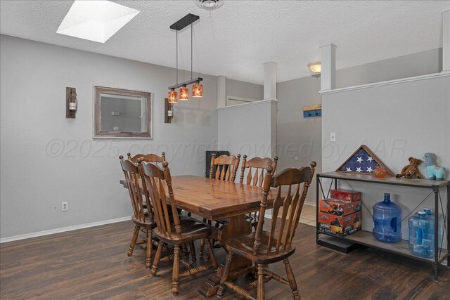 5021 Westway Trl, Amarillo, TX 79109 - dining space with a skylight, dark wood-style floors, baseboards, and a textured ceiling