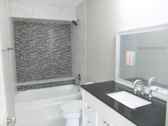 full bathroom with tiled shower / bath, tile patterned floors, toilet, and vanity