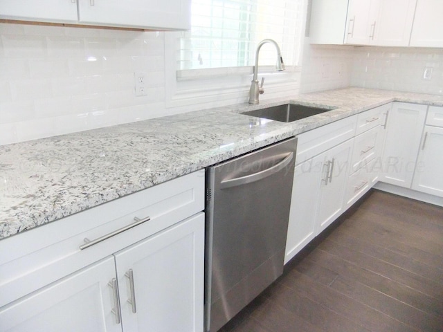 kitchen with dishwasher, white cabinetry, sink, and dark hardwood / wood-style floors