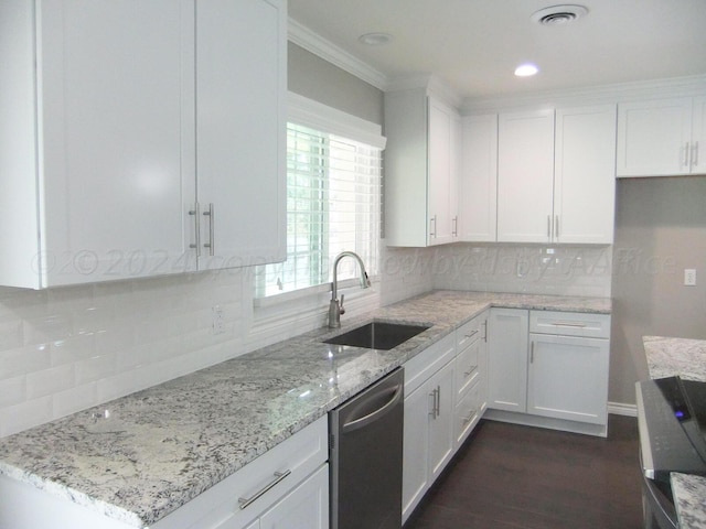 kitchen featuring white cabinetry, sink, dark hardwood / wood-style floors, backsplash, and stainless steel dishwasher