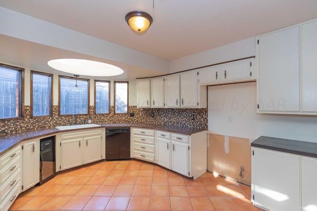 6011 Hatfield Cir, Amarillo, TX 79109 - kitchen with black dishwasher, dark countertops, beverage cooler, backsplash, and light tile patterned flooring