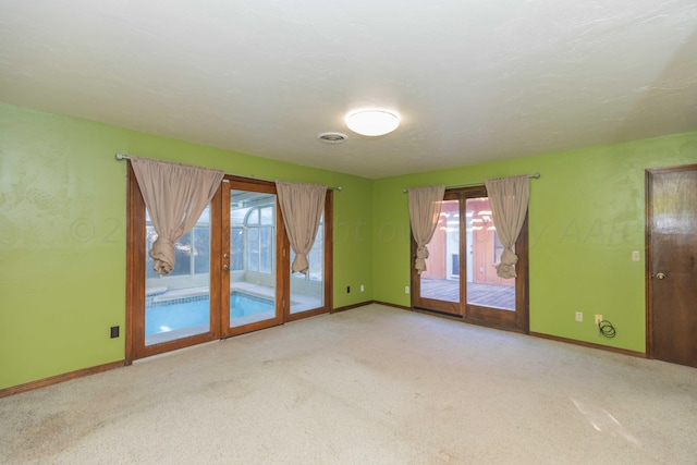 6011 Hatfield Cir, Amarillo, TX 79109 - carpeted spare room featuring baseboards and french doors