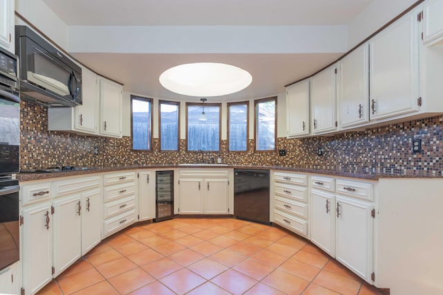 6011 Hatfield Cir, Amarillo, TX 79109 - kitchen featuring black appliances, dark countertops, wine cooler, and decorative backsplash