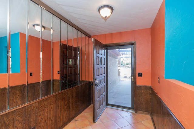 6011 Hatfield Cir, Amarillo, TX 79109 - doorway to outside featuring wainscoting and light tile patterned flooring