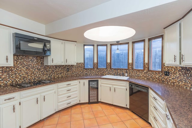 6011 Hatfield Cir, Amarillo, TX 79109 - kitchen featuring black appliances, beverage cooler, light tile patterned floors, and dark countertops