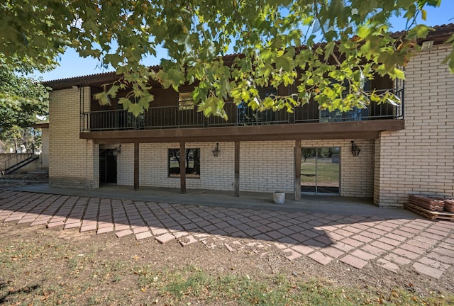 rear view of house featuring a patio area