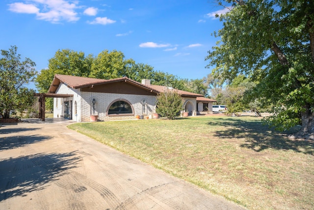 view of front of house with a garage and a front lawn