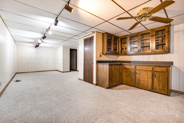 kitchen with a paneled ceiling, ceiling fan, and light colored carpet