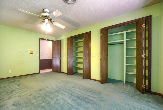 unfurnished bedroom with carpet flooring, ceiling fan, and a textured ceiling