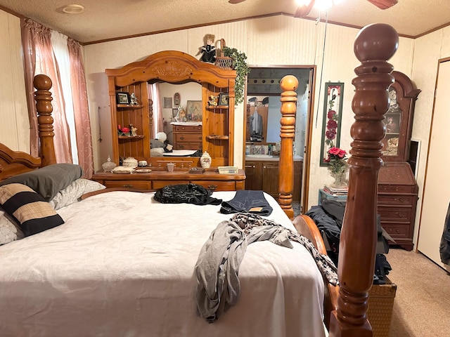 carpeted bedroom featuring lofted ceiling, a textured ceiling, and crown molding