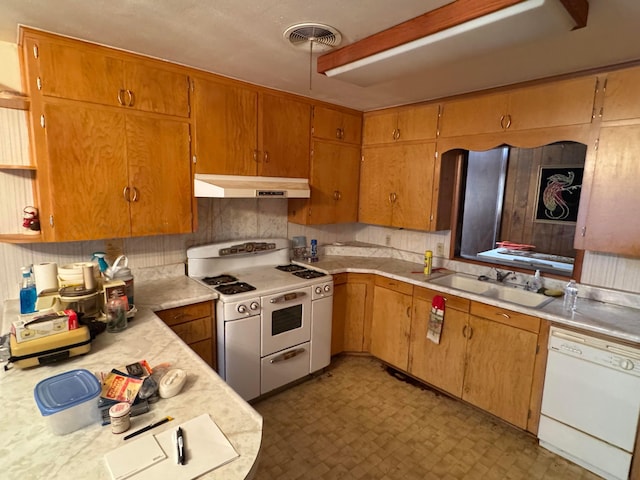 kitchen featuring sink and white appliances