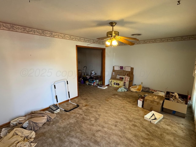 miscellaneous room featuring ceiling fan and carpet