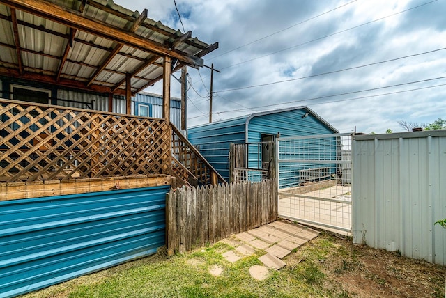 view of home's exterior with an outdoor structure