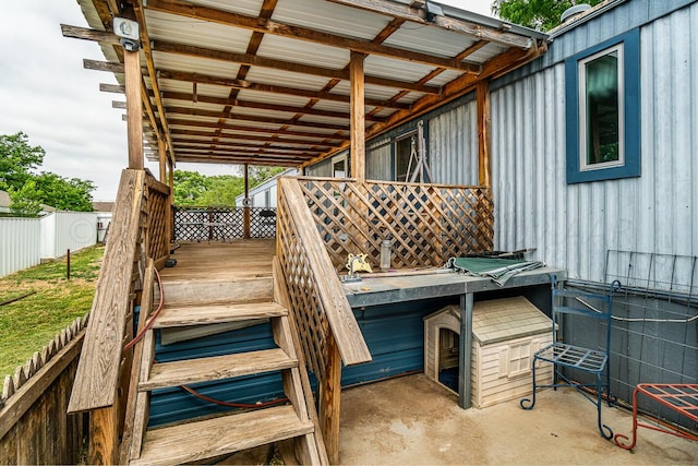 wooden deck with a patio area